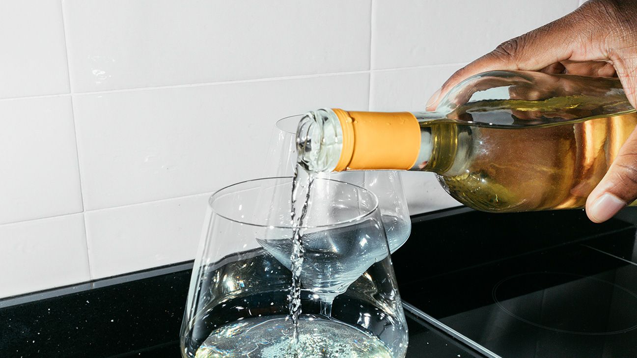 wine being poured into a glass